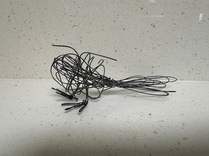 Julie Stewart in her New Zealand studio working on a wire sculpture